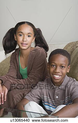 Portrait of brother and sister (12-13) at home View Large Photo Image Stock Image - Portrait of brother and sister (12-13) at home. Fotosearch