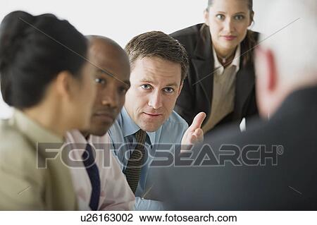 Stock Image - Portrait of business people in office. Fotosearch