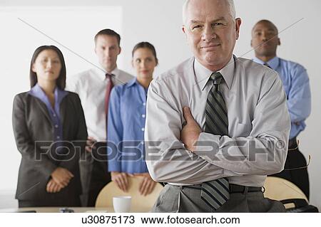 Stock Image - Portrait of business people in office. Fotosearch