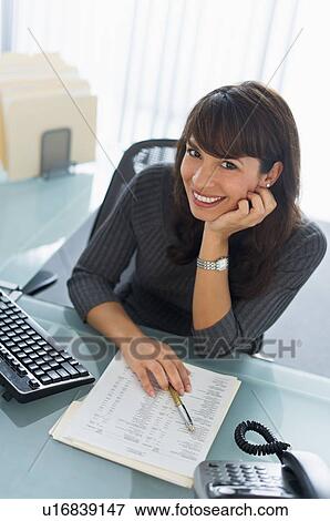 Portrait of business woman at desk View Large Photo Image Stock Photo - Portrait of business woman at desk. Fotosearch