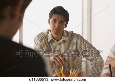 Portrait of businessman at meeting View Large Photo Image Stock Image - Portrait of businessman at meeting. Fotosearch