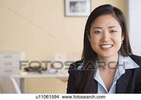 Portrait of businesswoman in office View Large Photo Image Picture - Portrait of businesswoman in office. Fotosearch
