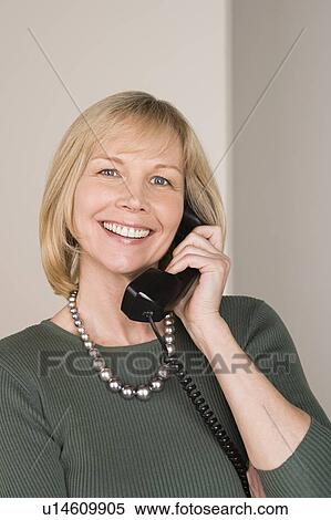 Portrait of businesswoman talking on phone View Large Photo Image Stock Photography - Portrait of businesswoman talking on phone. Fotosearch