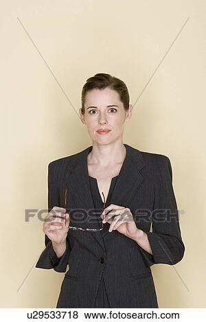 Stock Photo - Portrait of cheerful mid adult woman. Fotosearch