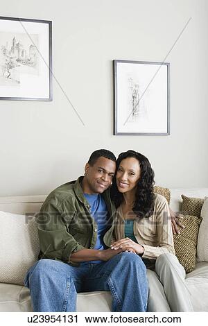 Stock Image - Portrait of couple at home. Fotosearch