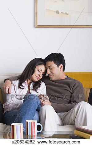 Portrait of couple on sofa View Large Photo Image Stock Image - Portrait of couple on sofa. Fotosearch