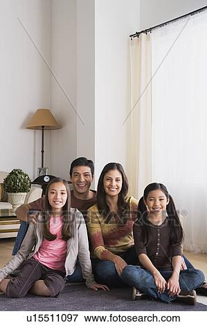 Stock Photo - Portrait of family with two daughters (8-9, 10-11). Fotosearch