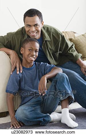 Portrait of Father and Son (12-13) at home View Large Photo Image Stock Image - Portrait of Father and Son (12-13) at home. Fotosearch