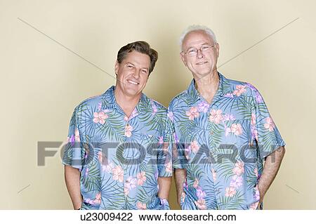 Portrait of father with adult son wearing Hawaiian shirts View Large Photo Image Stock Image - Portrait of father with adult son wearing Hawaiian shirts. Fotosearch