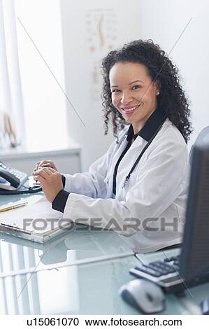 Portrait of female doctor in office View Large Photo Image Stock Image - Portrait of female doctor in office. Fotosearch
