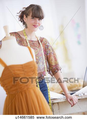 Portrait of female fashion designer in studio View Large Photo Image Stock Photography - Portrait of female fashion designer in studio. Fotosearch