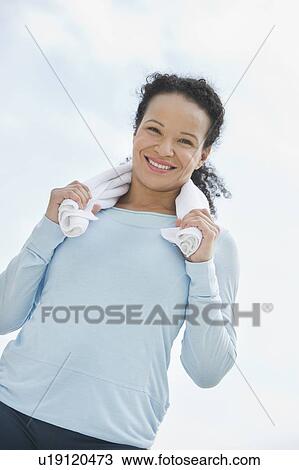 Stock Image - Portrait of female jogger. Fotosearch