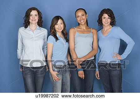 Stock Image - Portrait of four mid adult women including twins. Fotosearch
