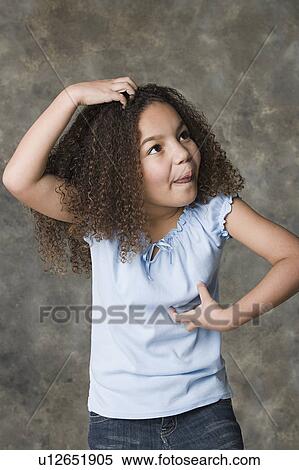 Portrait of girl (8-9) making face, studio shot View Large Photo Image Stock Photography - Portrait of girl (8-9) making face, studio shot. Fotosearch