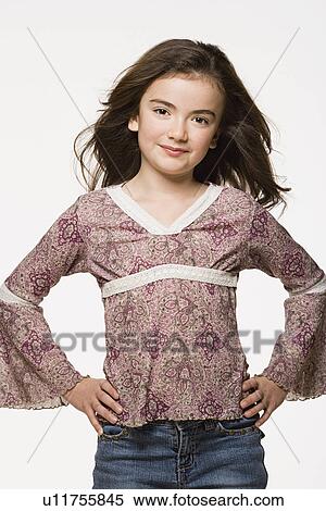 Portrait of girl (8-9) with hands on hips, studio shot View Large Photo Image Stock Photography - Portrait of girl (8-9) with hands on hips, studio shot. Fotosearch