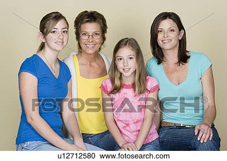 Stock Image - Portrait of grandmother, mother and two girls (8-9, 14-15). Fotosearch