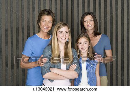 Stock Image - Portrait of grandmother, mother and two girls (8-9, 14-15). Fotosearch