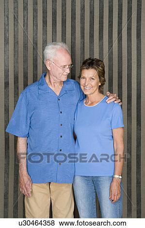 Stock Photo - Portrait of happy ageing couple. Fotosearch