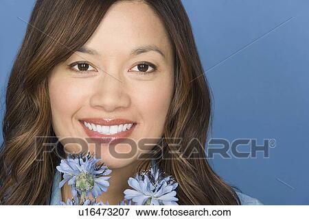 Portrait of happy asian woman with flowers View Large Photo Image Stock Photo - Portrait of happy asian woman with flowers. Fotosearch