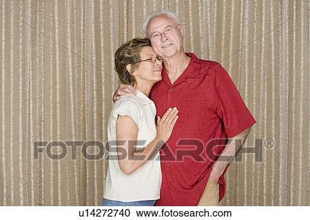 Portrait of happy couple embracing View Large Photo Image Stock Image - Portrait of happy couple embracing. Fotosearch