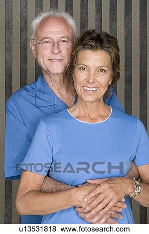 Stock Photo - Portrait of happy couple embracing. Fotosearch