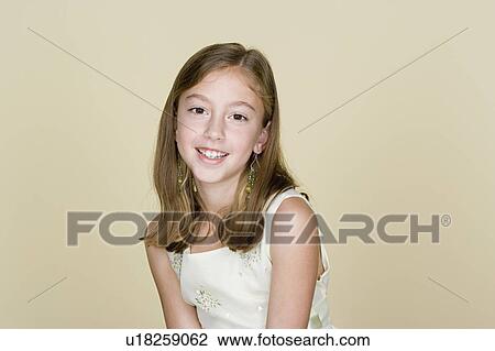 Stock Image - Portrait of happy girl (8-9). Fotosearch