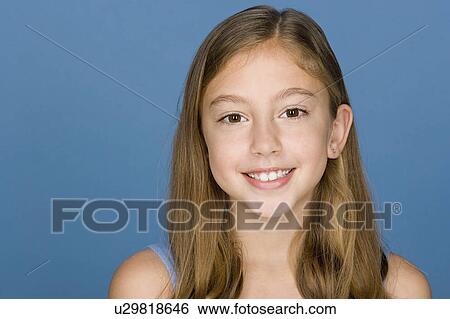Stock Photograph - Portrait of happy girl (8-9). Fotosearch