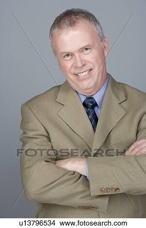 Portrait of happy mature businessman View Large Photo Image Picture - Portrait of happy mature businessman. Fotosearch