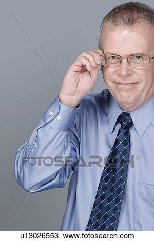 Portrait of happy mature businessman View Large Photo Image Stock Image - Portrait of happy mature businessman. Fotosearch