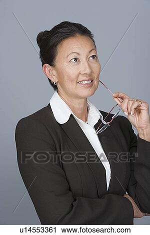 Stock Image - Portrait of happy mature businesswoman. Fotosearch