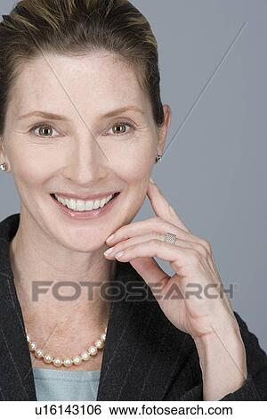 Portrait of happy mature businesswoman View Large Photo Image Stock Photograph - Portrait of happy mature businesswoman. Fotosearch
