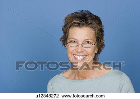 Stock Image - Portrait of happy mature woman. Fotosearch