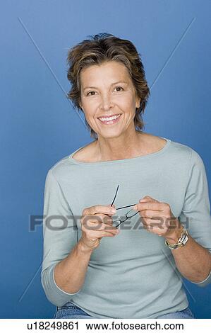 Stock Image - Portrait of happy mature woman. Fotosearch