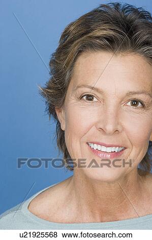Portrait of happy mature woman View Large Photo Image Stock Photo - Portrait of happy mature woman. Fotosearch
