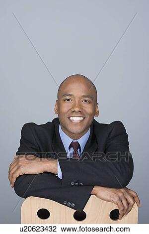 Portrait of happy mid adult businessman View Large Photo Image Stock Image - Portrait of happy mid adult businessman. Fotosearch
