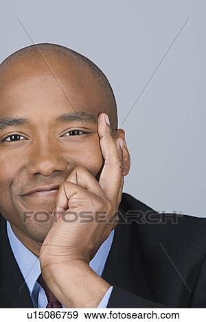 Stock Photo - Portrait of happy mid adult businessman. Fotosearch