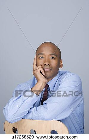 Portrait of happy mid adult businessman View Large Photo Image Stock Photo - Portrait of happy mid adult businessman. Fotosearch