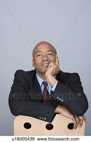Stock Photo - Portrait of happy mid adult businessman. Fotosearch