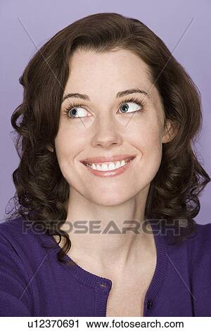 Stock Image - Portrait of happy mid adult woman . Fotosearch