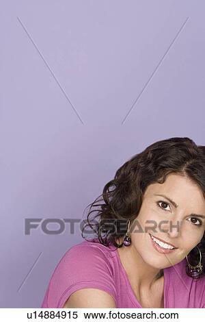Portrait of happy mid adult woman wearing pink top View Large Photo Image Stock Photography - Portrait of happy mid adult woman wearing pink top. Fotosearch