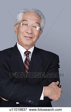 Stock Photo - Portrait of happy senior businessman. Fotosearch