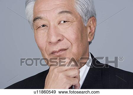 Stock Photo - Portrait of happy senior businessman. Fotosearch