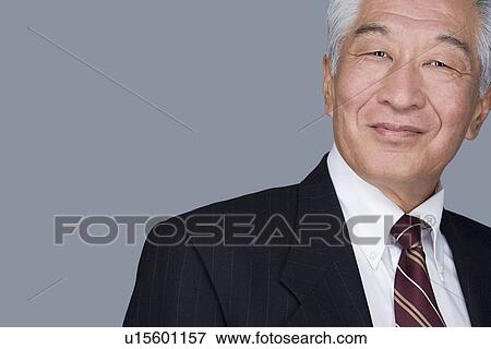 Stock Photo - Portrait of happy senior businessman. Fotosearch