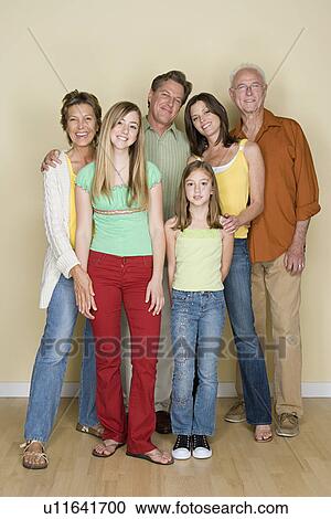 Portrait of happy three-generation family with two girls (8-9, 14-15) View Large Photo Image Stock Image - Portrait of happy three-generation family with two girls (8-9, 14-15). Fotosearch