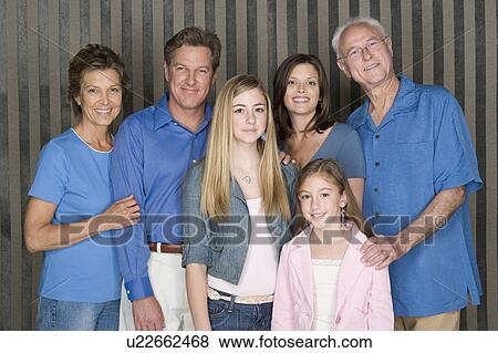 Portrait of happy three-generation family with two girls (8-9, 14-15) View Large Photo Image Stock Photo - Portrait of happy three-generation family with two girls (8-9, 14-15). Fotosearch