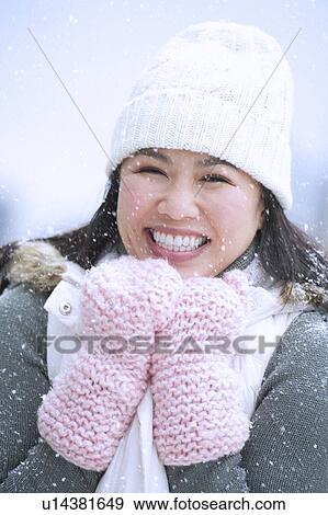 Portrait of happy woman wearing warm clothing View Large Photo Image Stock Photo - Portrait of happy woman wearing warm clothing. Fotosearch