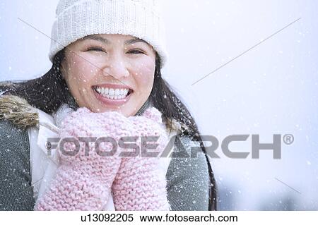 Portrait of happy woman wearing warm clothing View Large Photo Image Stock Photography - Portrait of happy woman wearing warm clothing. Fotosearch