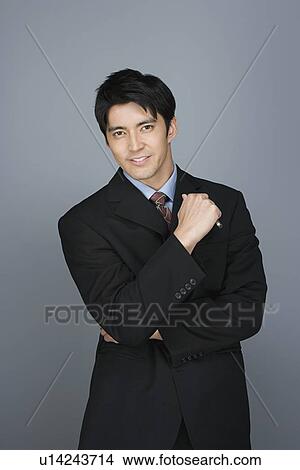 Picture - Portrait of happy young businessman. Fotosearch