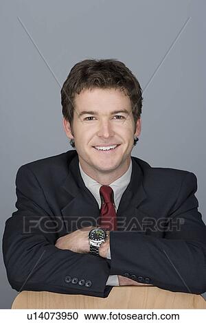 Stock Image - Portrait of happy young businessman. Fotosearch