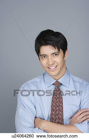 Portrait of happy young businessman View Large Photo Image Stock Image - Portrait of happy young businessman. Fotosearch